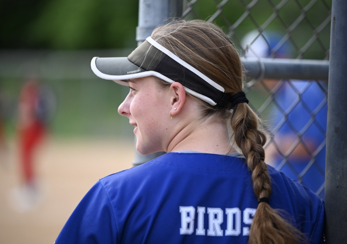 Camryn Markus (11) smiles at a teammate. 